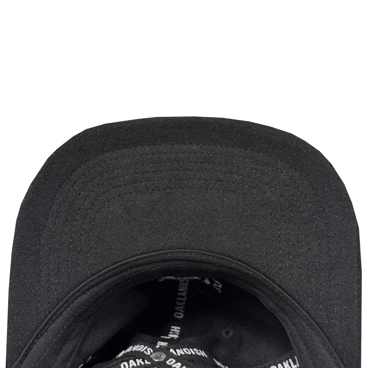 Close-up of the Oakland Ballers B Strapback underside with a curved brim and interior lining. The black sweatband area features repeated white "OAKLAND BALLERS" branding. The hat is shown against a white background.